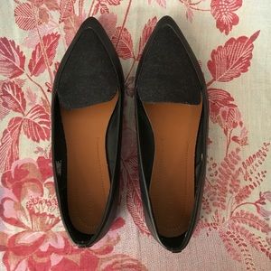 Black loafers with a pointy toe